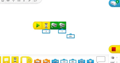 Среда программирования WeDo 2.0: холст с цепочкой блоков и палитра внизу экрана приложения
